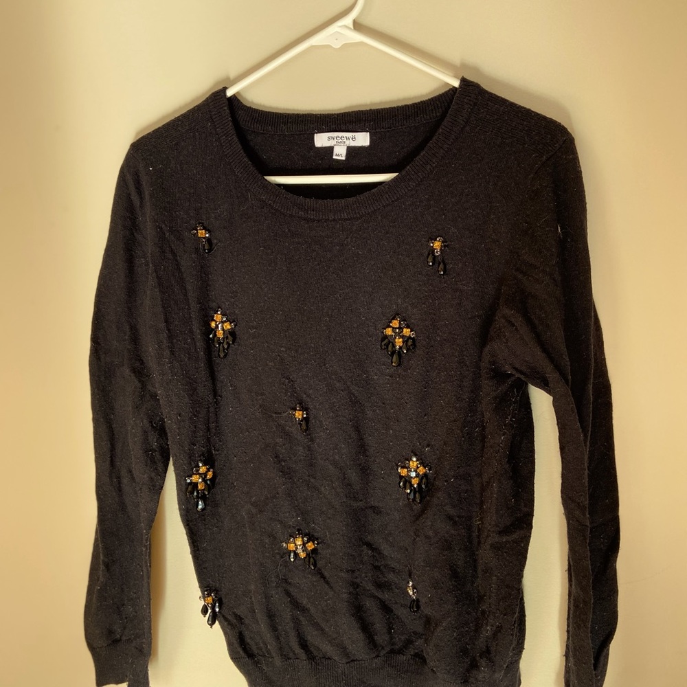 This sweater is tried and true looking for a new person to warm up this winter